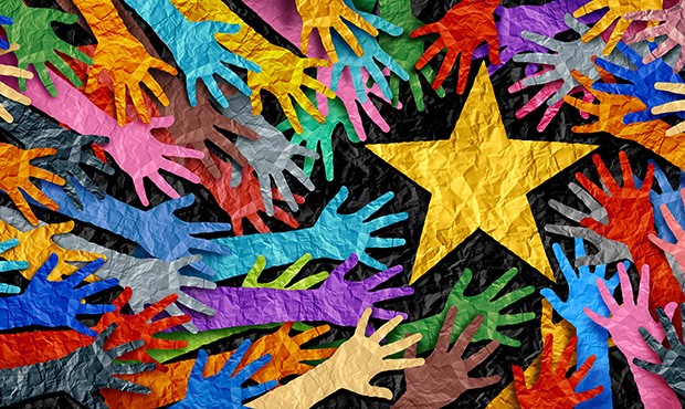 multi-colored hands reaching for a gold star