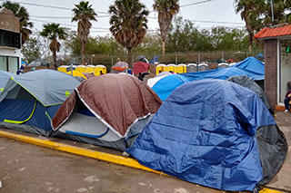 The tent city has limited number of Porta Potties, Matamoros, Mexico